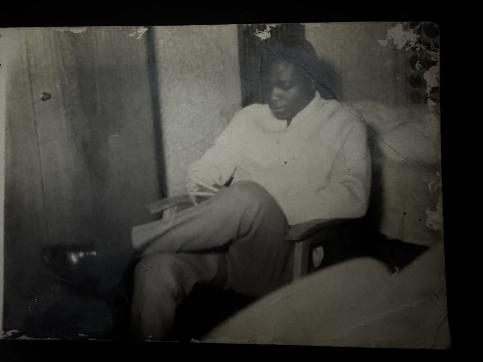 A young David Boa-Essilfie seated at home
