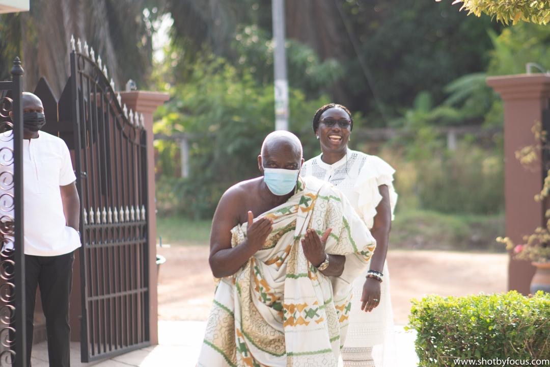 Daddy arriving in traditional cloth, with Ama behind him