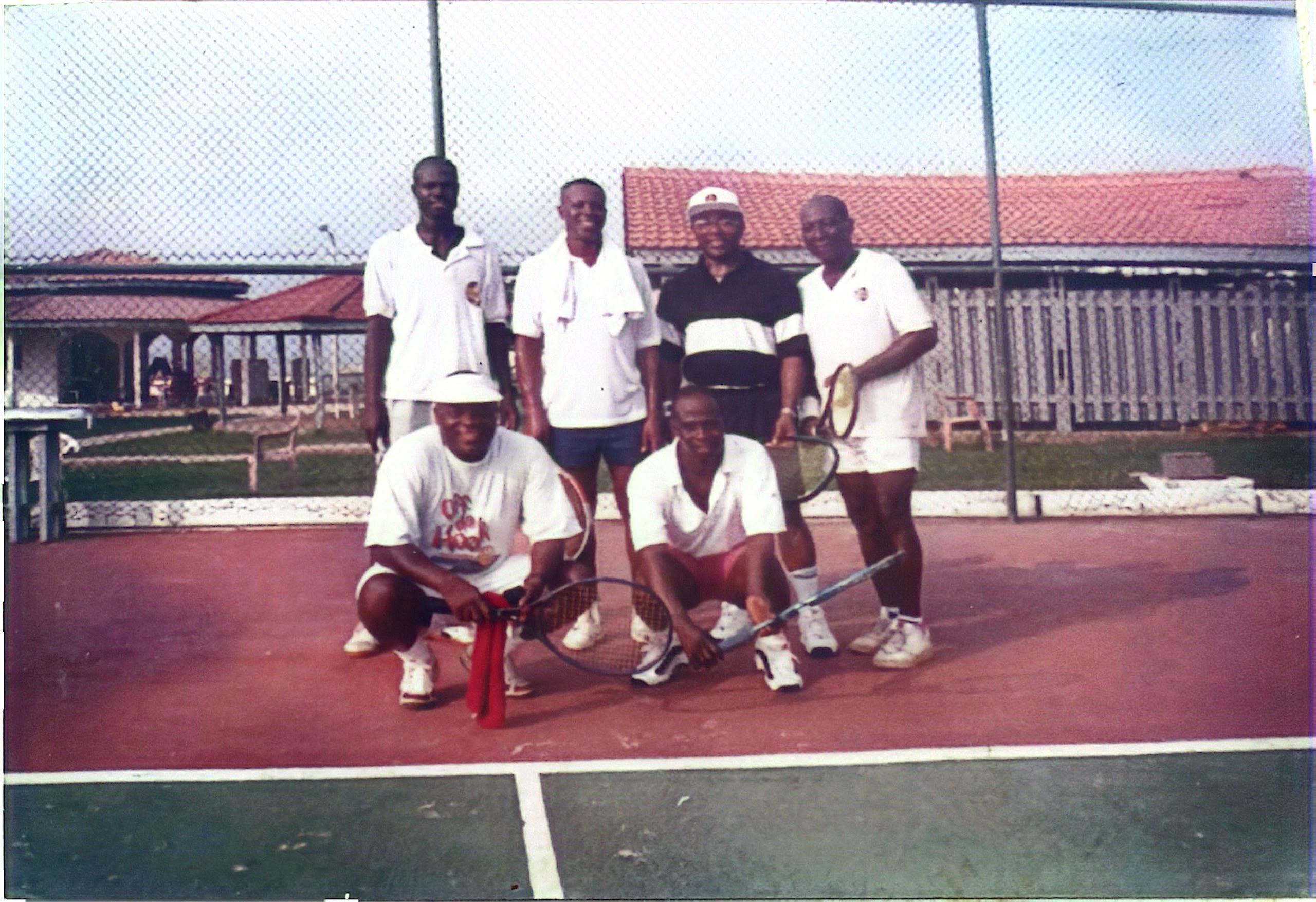 With fellow players on the tennis court